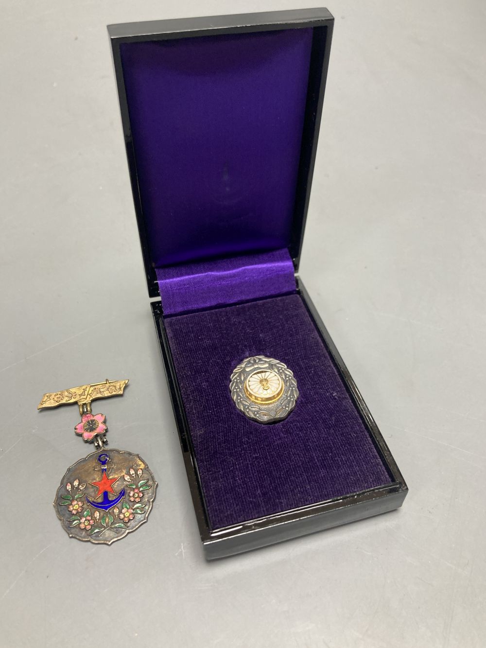 Two Japanese historic medals possibly silver and enamel